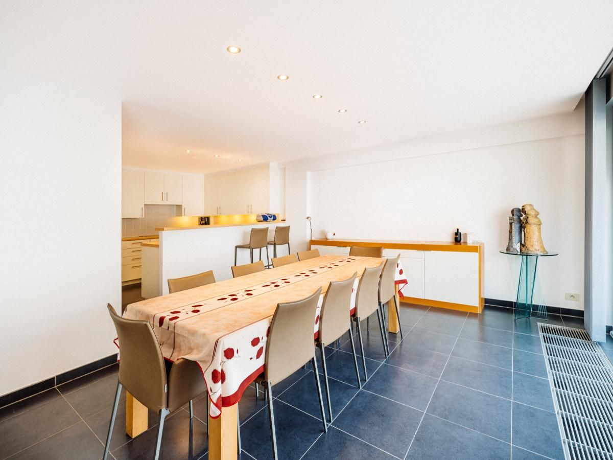 Spacious dining room in vacation home Brit Eerste, Koksijde, Belgium, ideal for family gatherings and socializing.