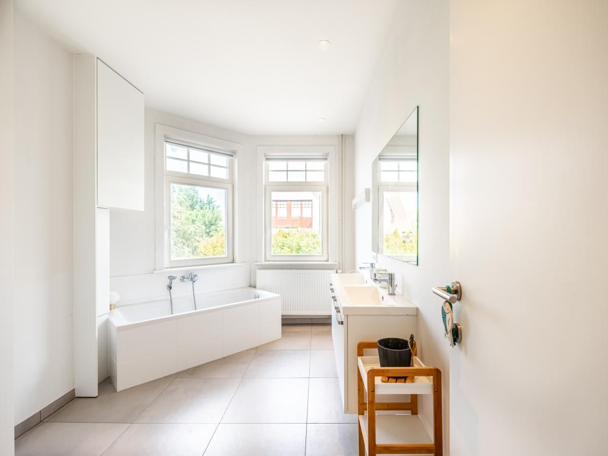 Bright bathroom in vacation home Au Coin, Koksijde, West Flanders with modern amenities and garden views.