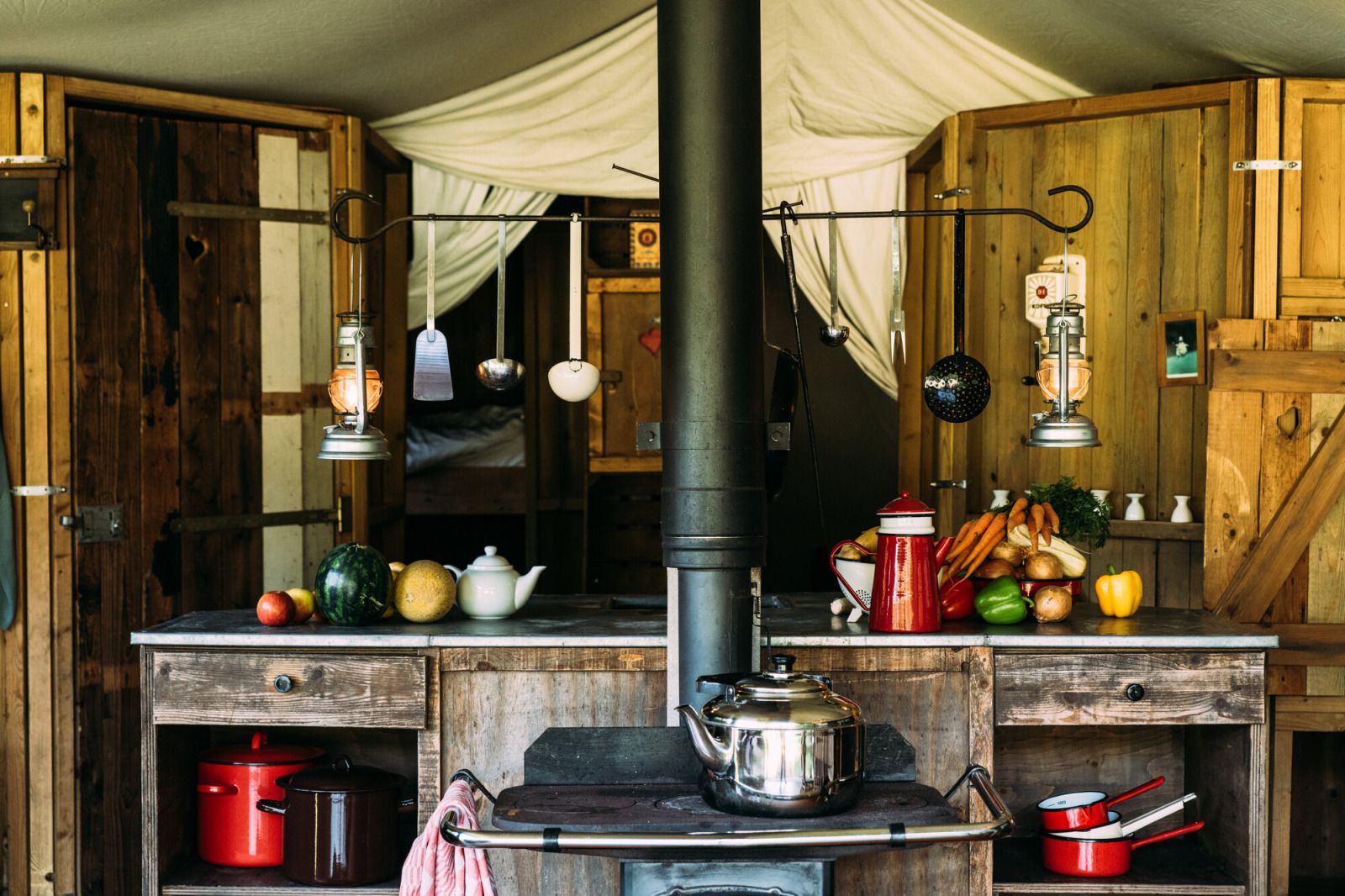 Cozy kitchen of Tent House with hot private shower in Torhout, West Flanders, Belgium, with rustic charm and modern conveniences.