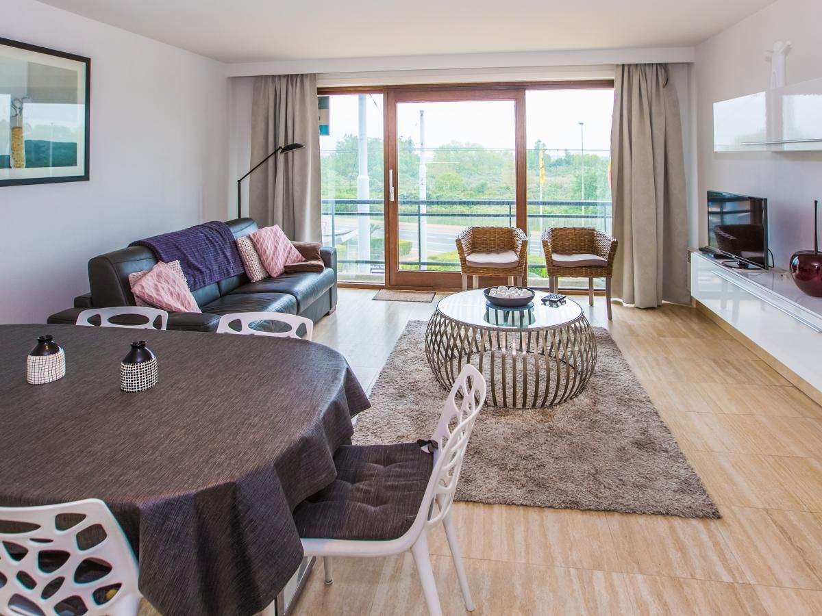 Gemuetliches Wohnzimmer im Ferienhaus Escale II - 0201 in Middelkerke mit moderner Einrichtung und einer grosszuegigen Sitzecke - ideal zum Entspannen.