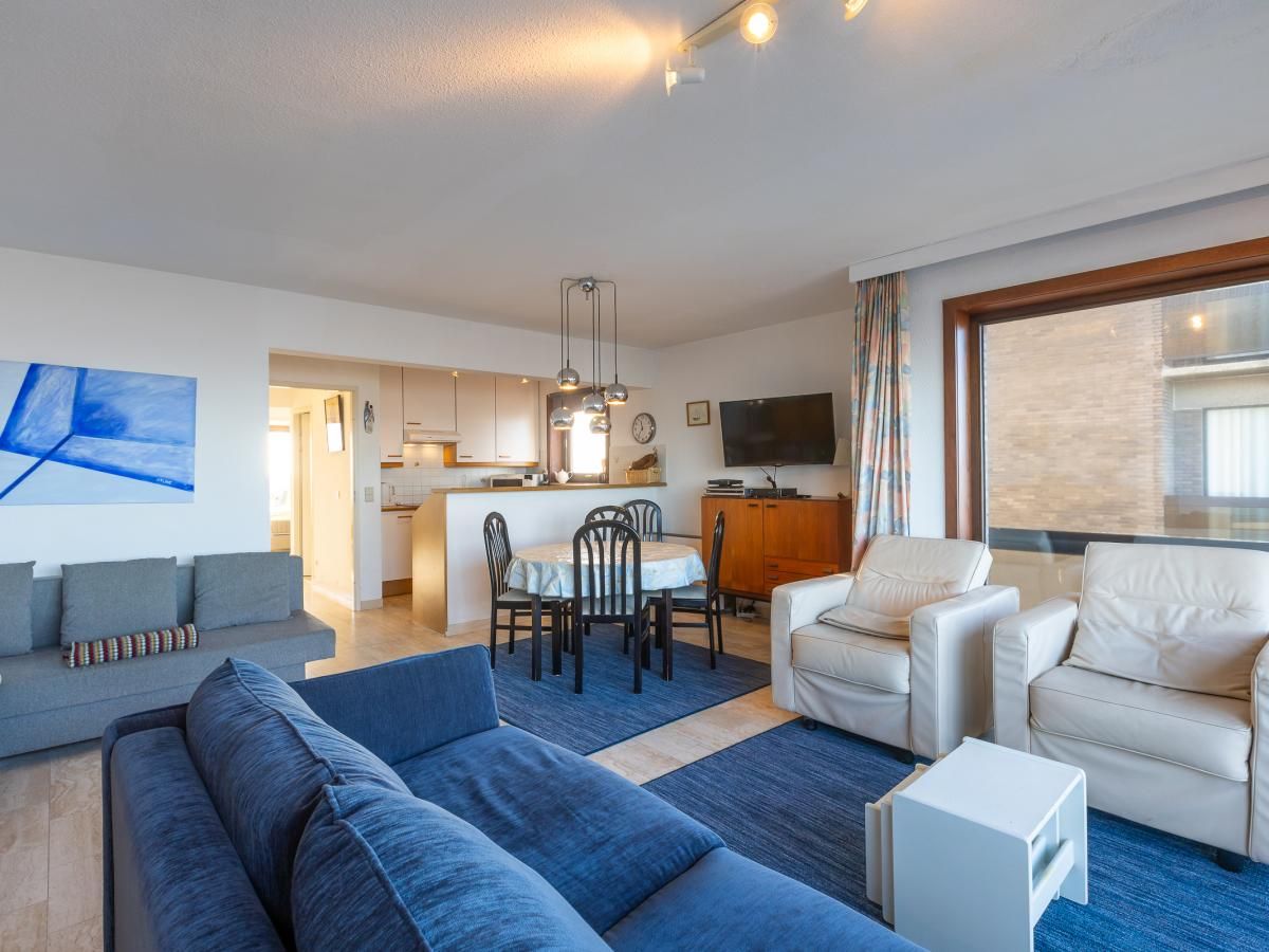 Gemuetliches Wohnzimmer in Dunekant - 0203 + park.6 Ferienhaus in Middelkerke, Westflandern, mit komfortabler Sitzecke und moderner Einrichtung.