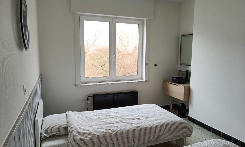 Papa's Dream vacation home in Oostduinkerke, bright bedroom overlooking nature.