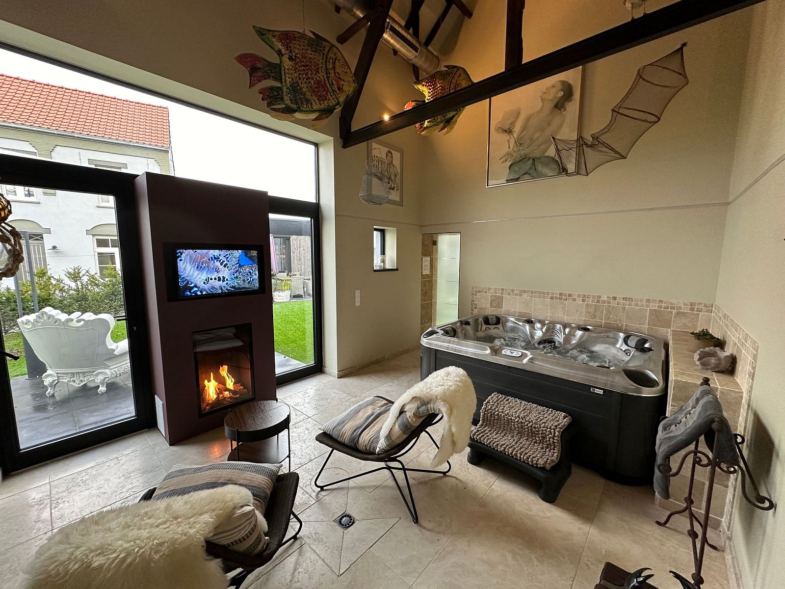 Relax in the luxurious wellness area of Holiday Home Einzigartiger Wellness-Bauernhof in Wichelen, East Flanders, with jacuzzi and fireplace.