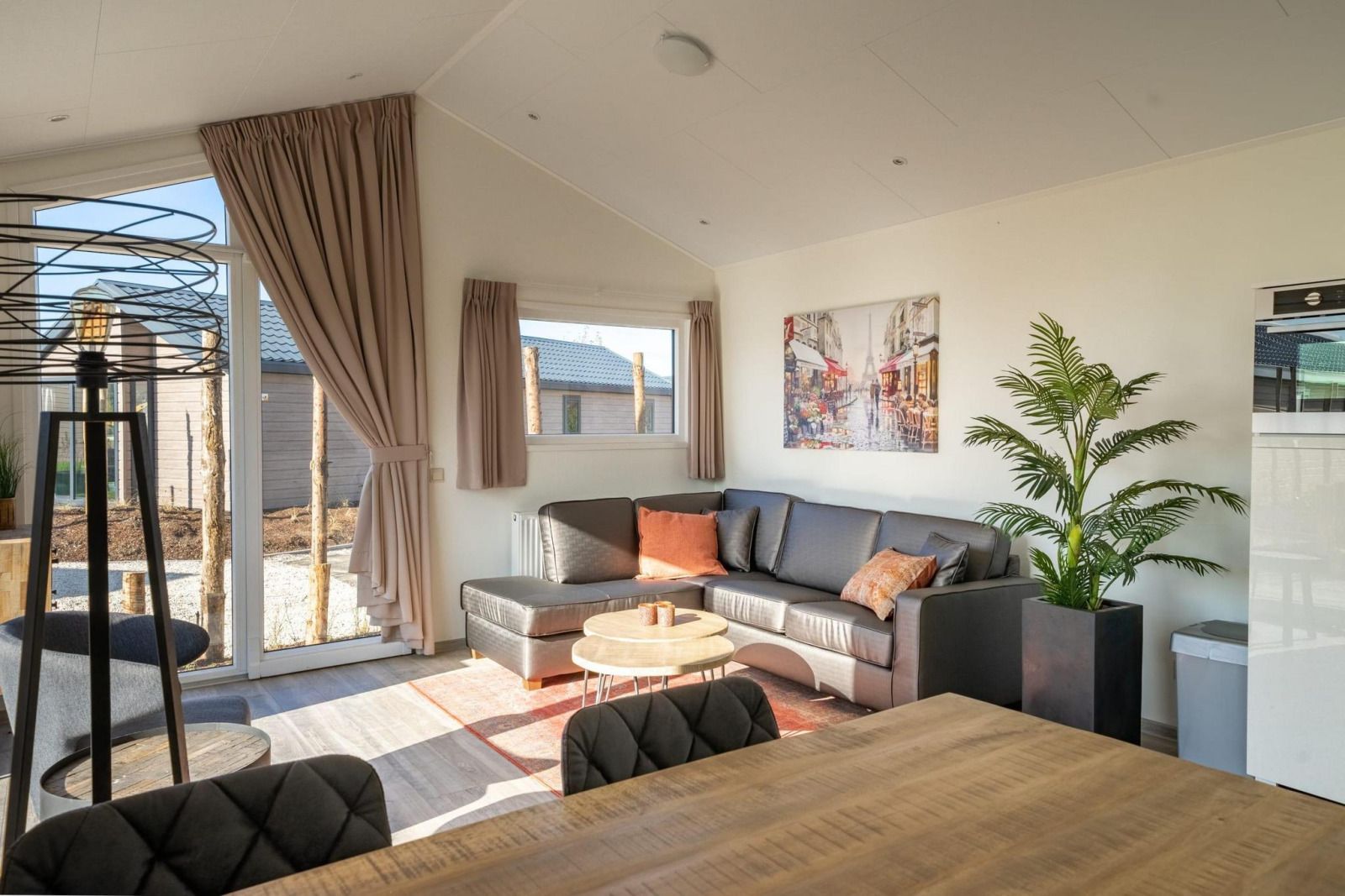 Cozy living room of vacation home Velthorst in Mol, Antwerp, Belgium, with modern decor and lots of natural light.