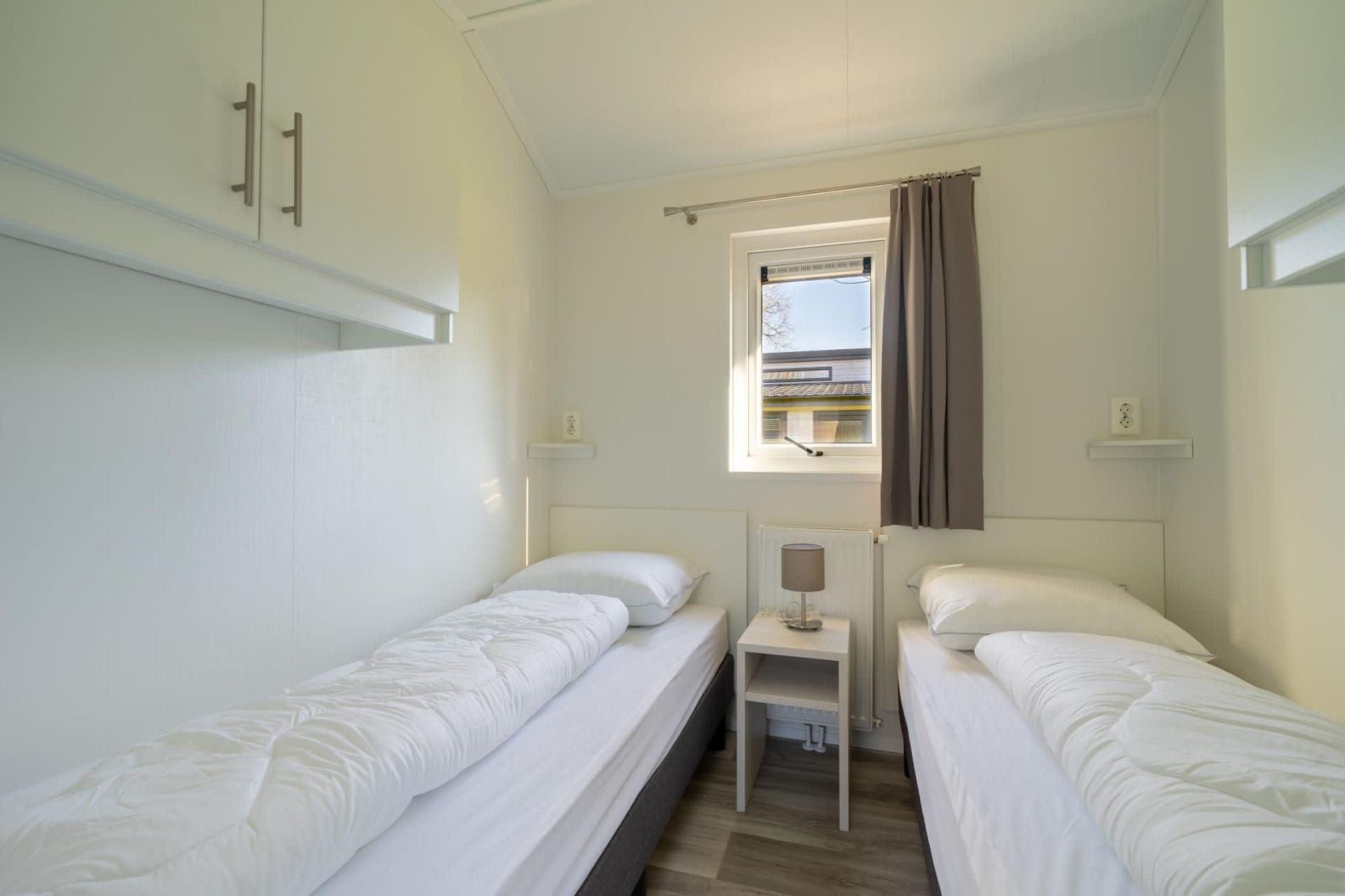 Modern bathroom in vacation home Velthorst in Mol, Antwerp, with glass shower and natural light.