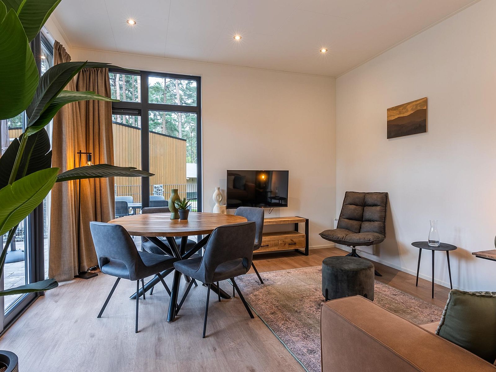 Cozy living room in a detached house in 2400 Mol, Antwerp, Belgium, with modern interior and views of the green surroundings.