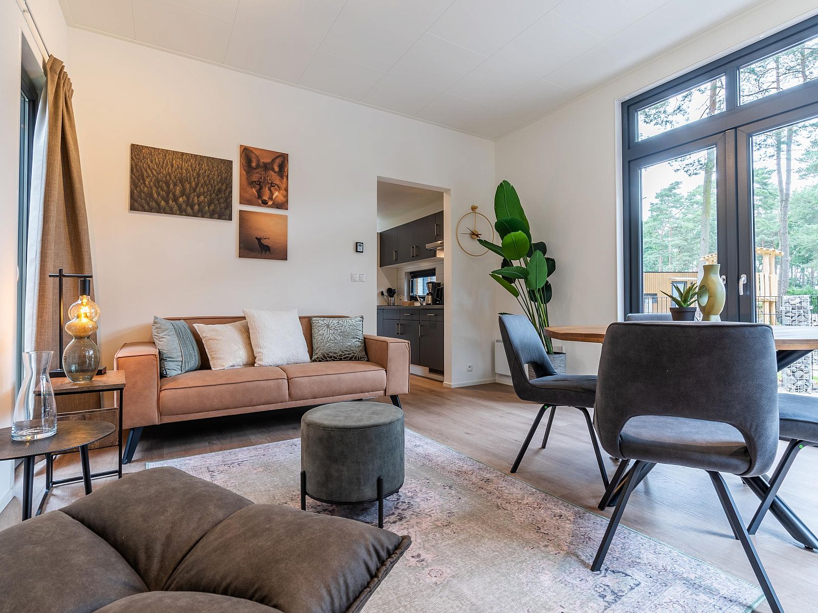 Cozy living room of the detached house in 2400 Mol, vacation home in Mol, Antwerp, Belgium with modern furnishings and views of nature.