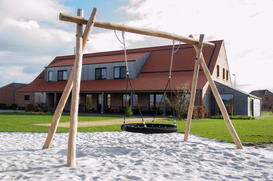 Swing in the playground of Driehoekshoeve vacation home, Kasterlee, Antwerp.