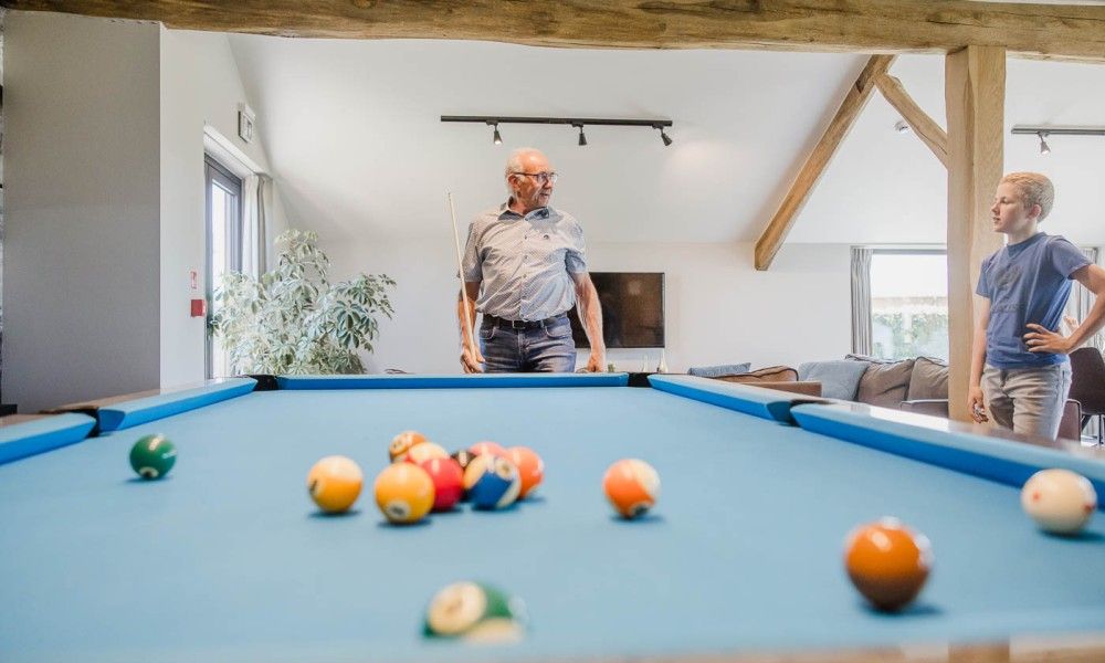 Billiard room in Driehoekshoeve vacation home, Kasterlee, Antwerp for relaxation and games.