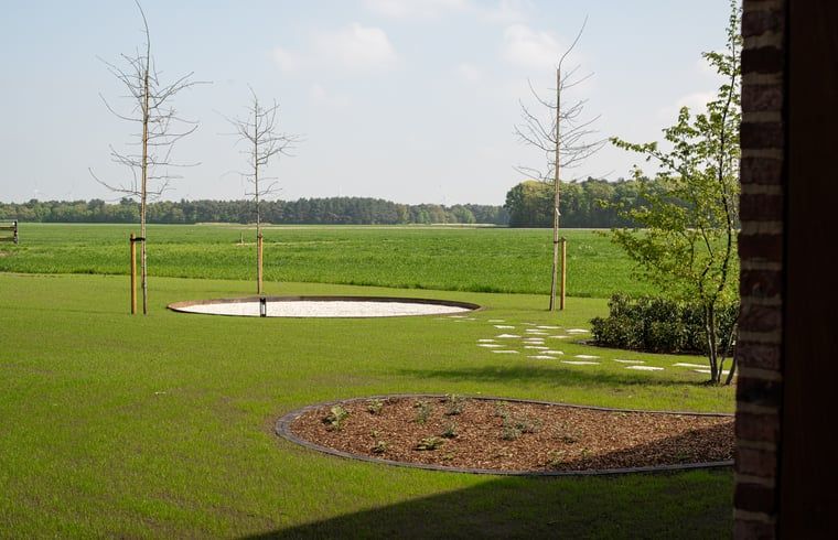 Enjoy the serene garden and expansive views at Holiday Home in Kasterlee, located in green Antwerp, Belgium.