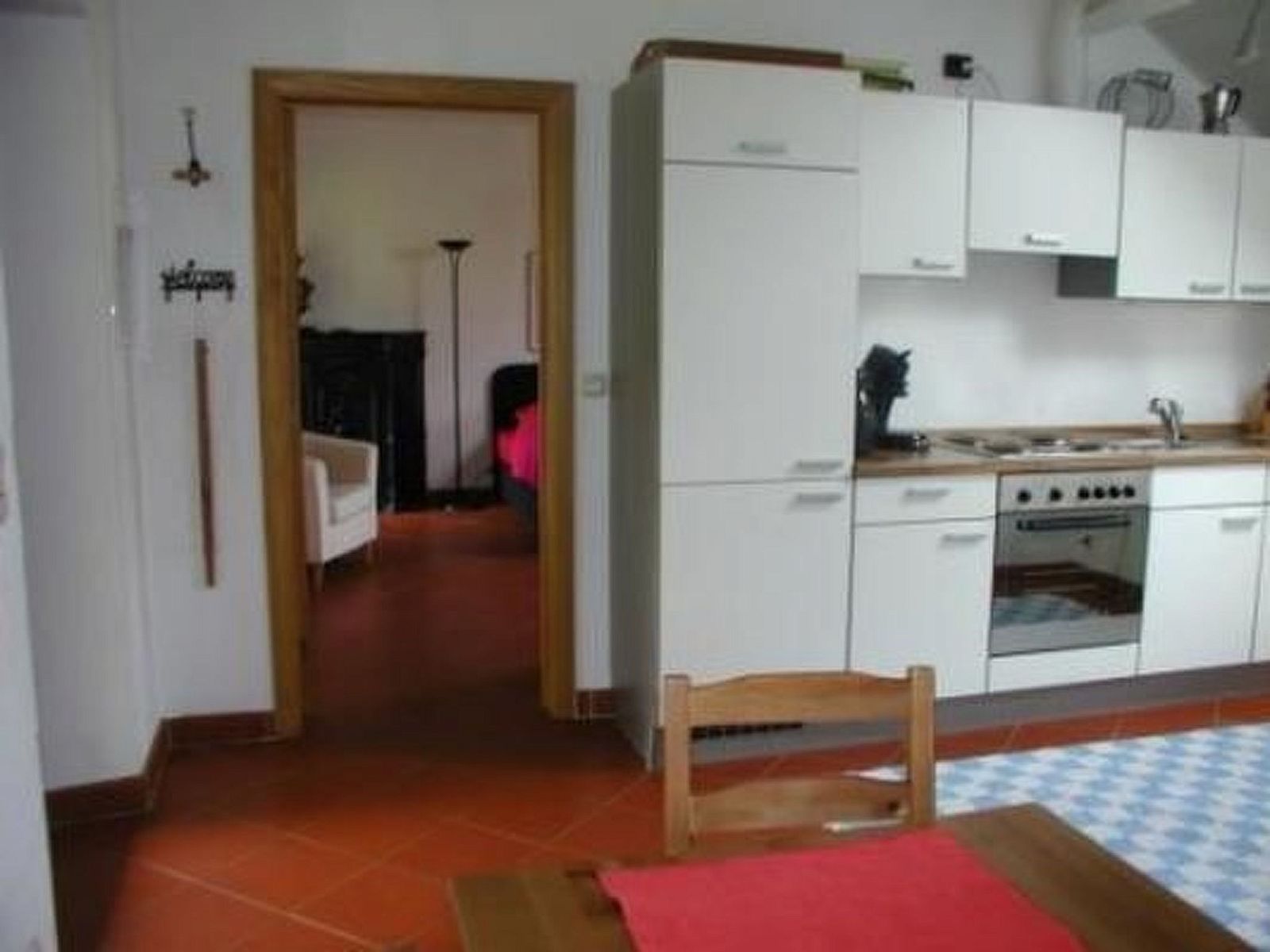 Cozy kitchen of Apartment Vue au Jardin in Hombourg, Ardennes, Belgium, with modern facilities and access to the cozy living room.