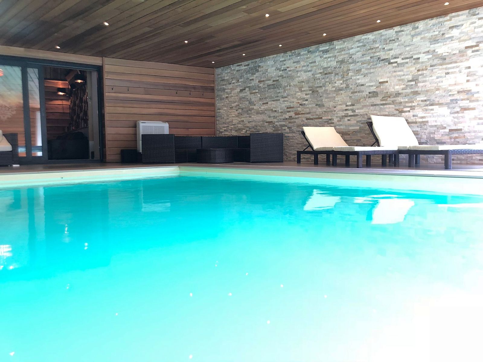 Relax by the indoor pool of Holiday Home Villa 'Marie France' Wellness in Stavelot, Ardennes, ideal for 9 people.