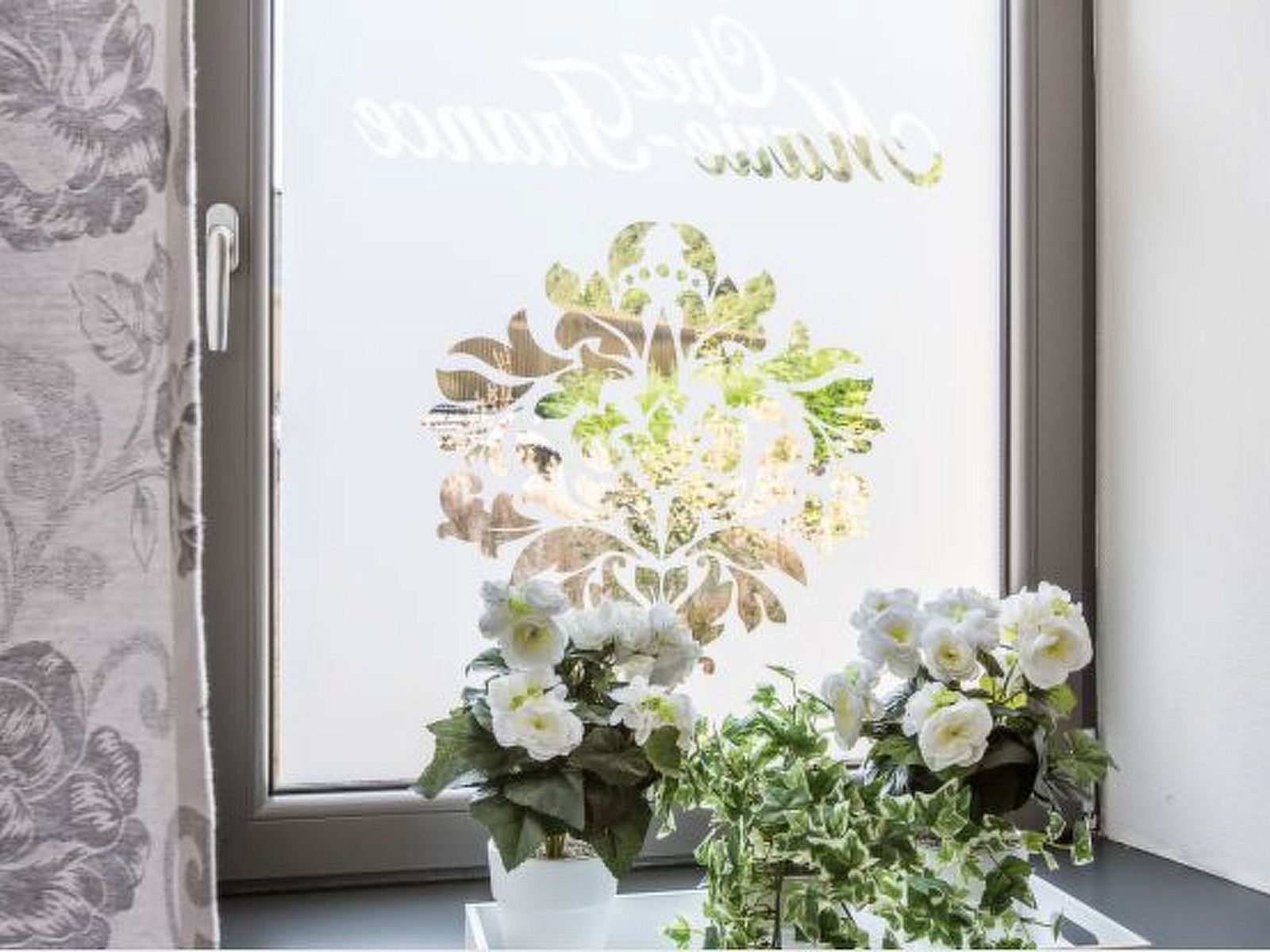 Charming interior of Holiday Home Villa 'Marie France' Wellness in Stavelot, Ardennes, with rustic wooden chest of drawers and decorations.