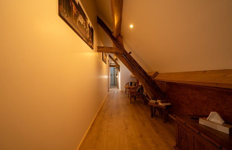 Cozy hallway with wooden beams in Holiday home in Sivry, Hainaut, Belgium, offers a warm and authentic atmosphere.
