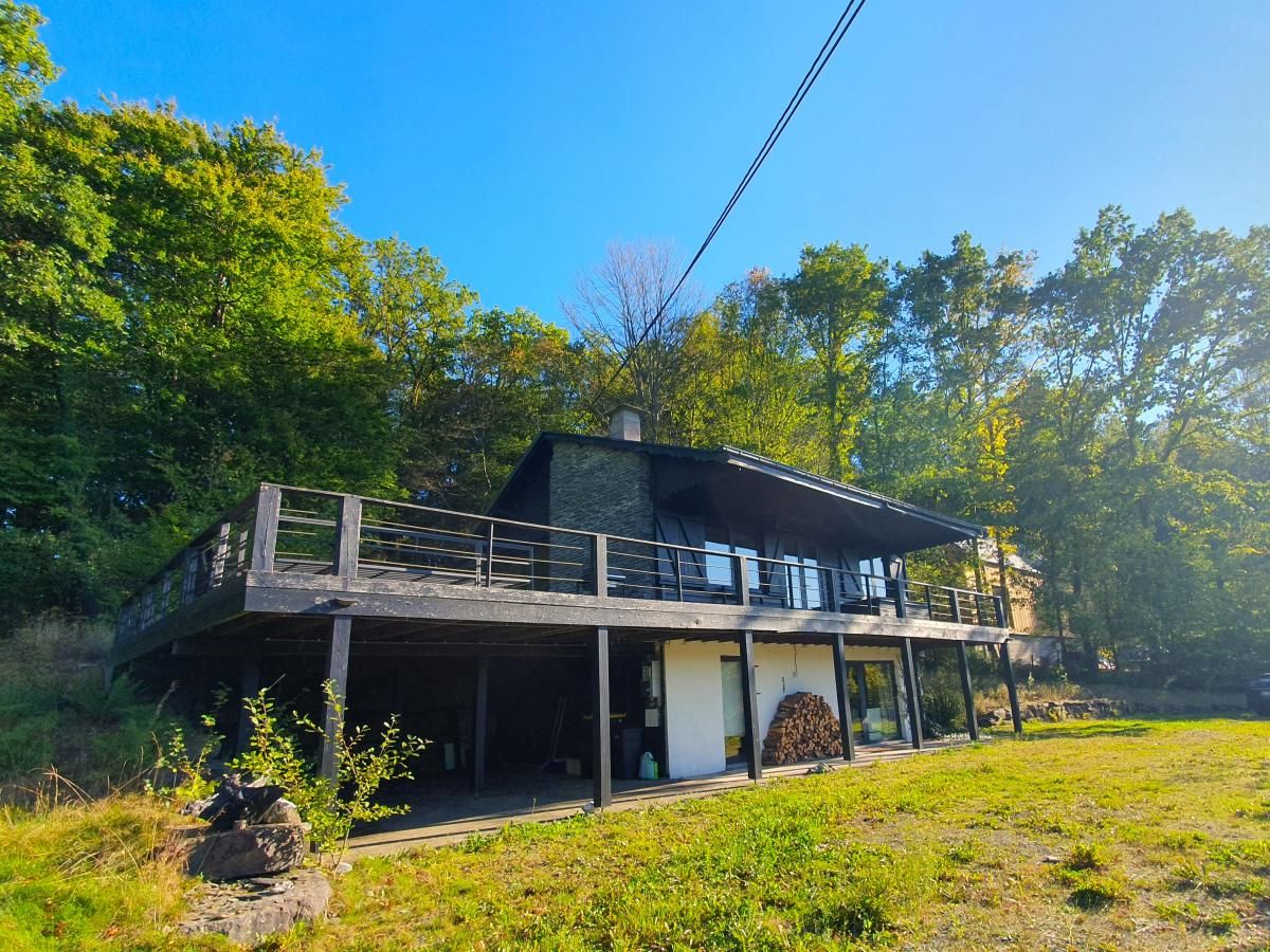 Chalet Agathe in Laforet, Ardennes, Belgium with spacious terrace and surrounded by lush nature.