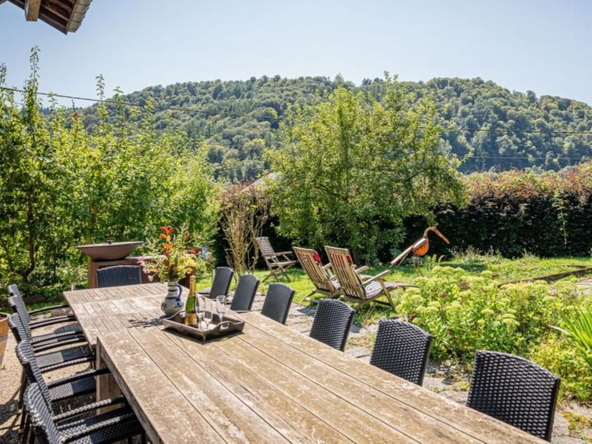 Leora Cosy vacation home in Membre, Ardennes, Belgium with sunny terrace and green surroundings for a relaxing stay.