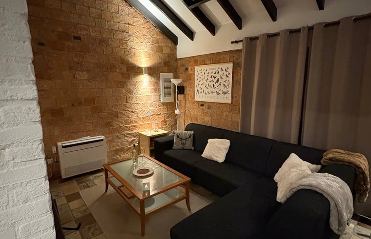 Cozy living room in Holiday home in Izier, Ardennes, Belgium with comfortable seating area and atmospheric lighting.