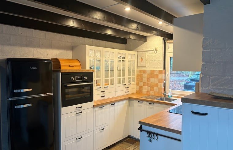 Modern kitchen in Cottage in Izier, located in the Ardennes, Luxembourg, Belgium. Cozy indoor space with country charm.