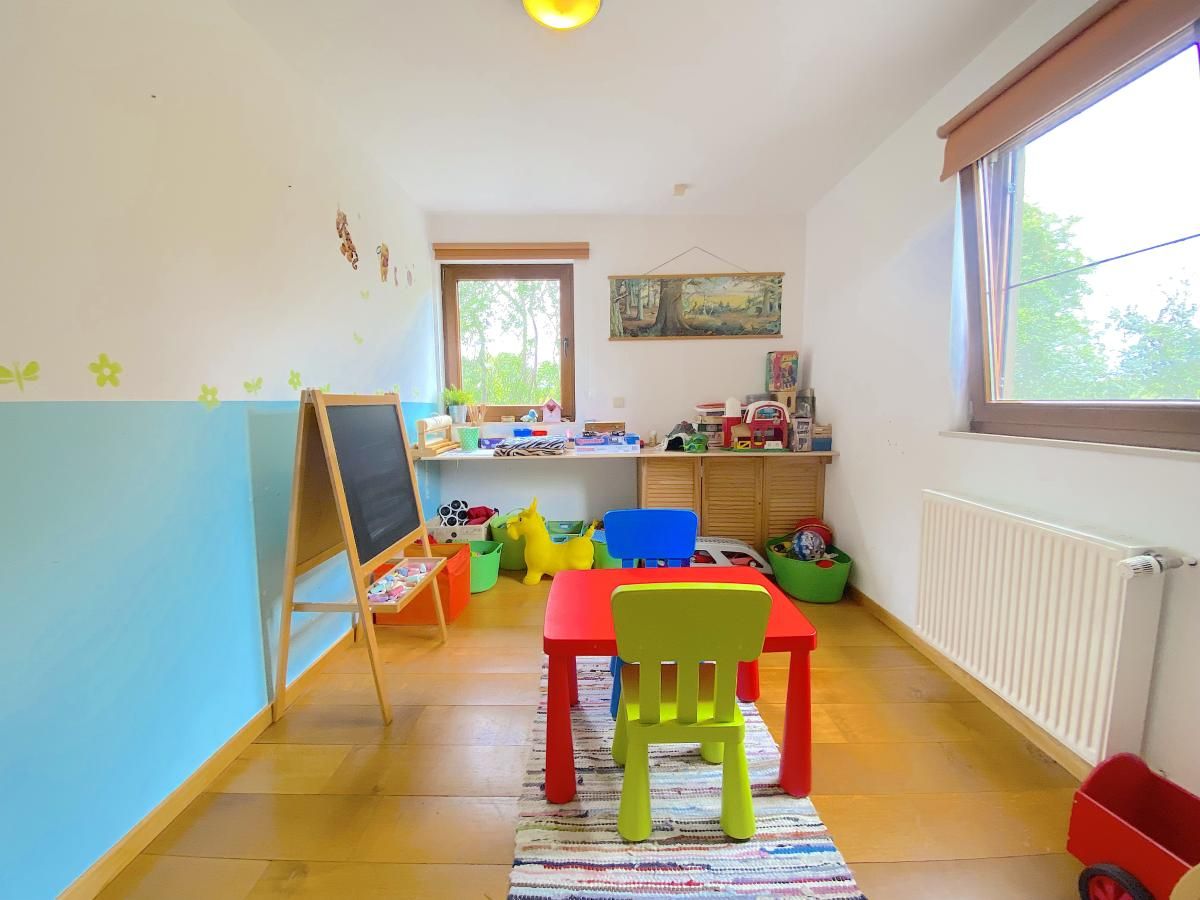 Playroom for children in Holiday Home Wilogne, Houffalize, with colorful interior and toys.