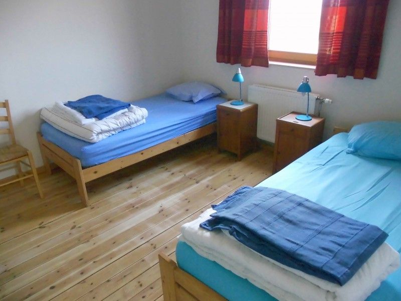 Knusse slaapkamer met houten vloer in La Terra vakantiehuis, Durbuy.