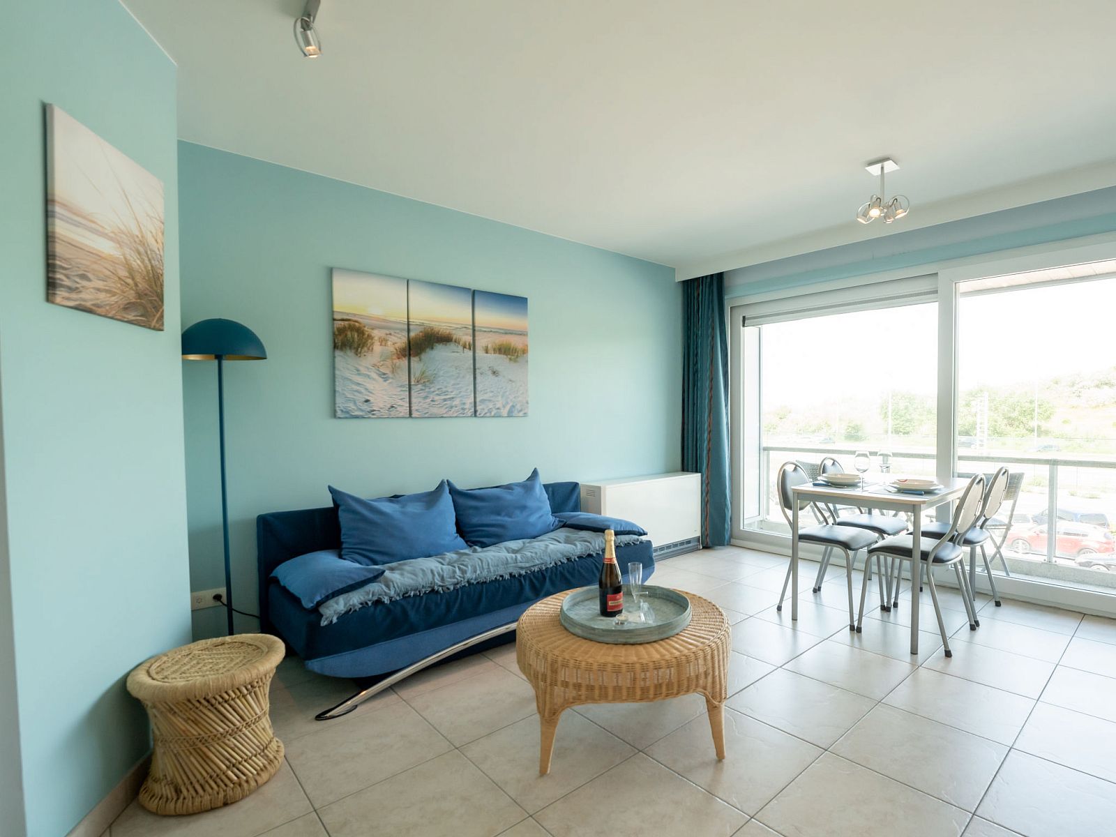 Bright living room of Apartment Lautrec in Bredene, Belgian coast, with a view of nature and a cozy sitting area.
