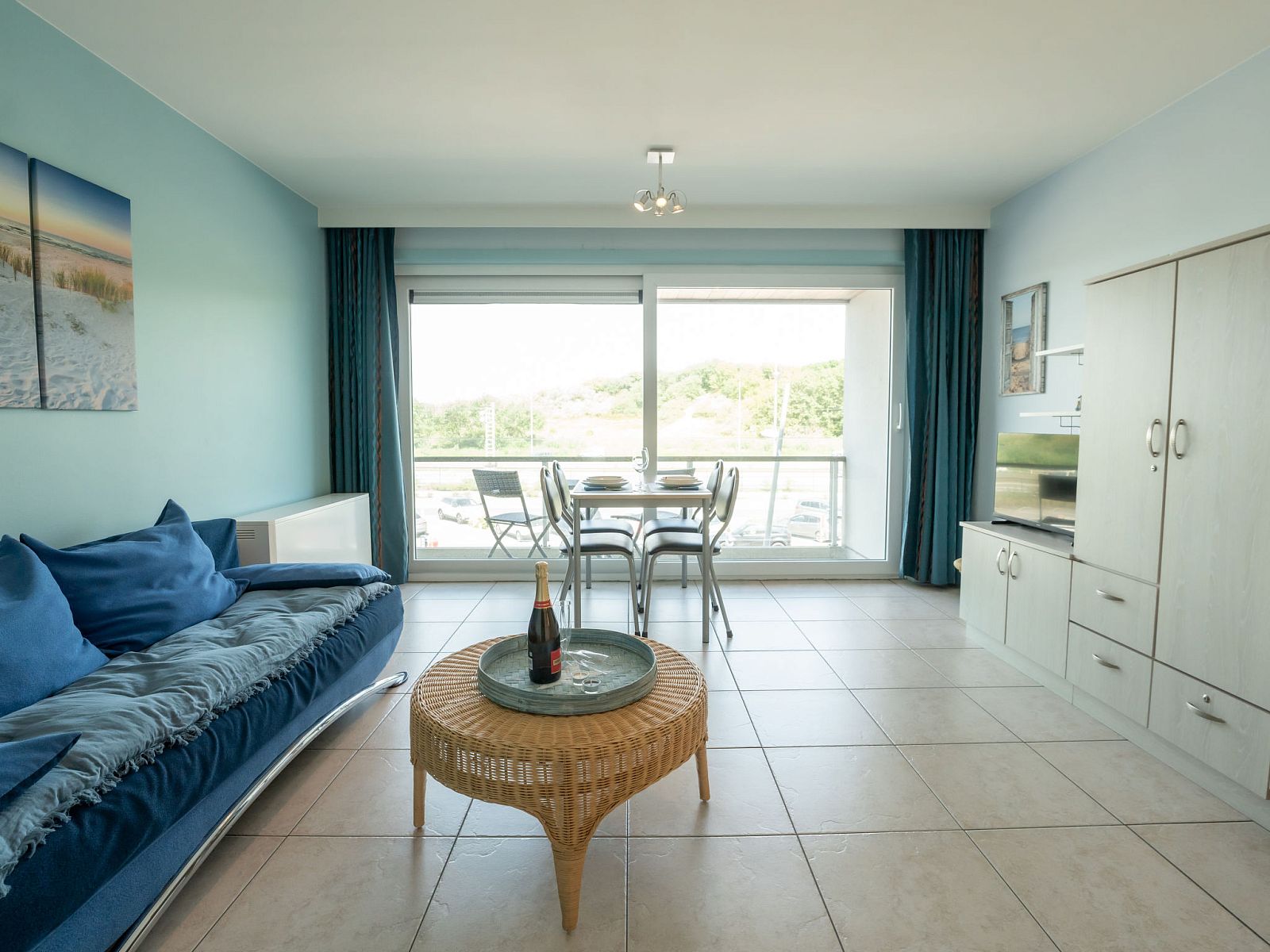 Cozy living room in Apartment Lautrec, Bredene, Belgian coast. Comfortable indoor space with a view of the green surroundings.