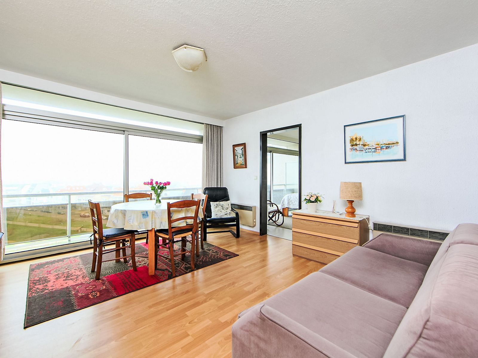 Cozy living room of Apartment Ref. 702 in Bredene, Belgian coast, with panoramic views and comfortable furniture.