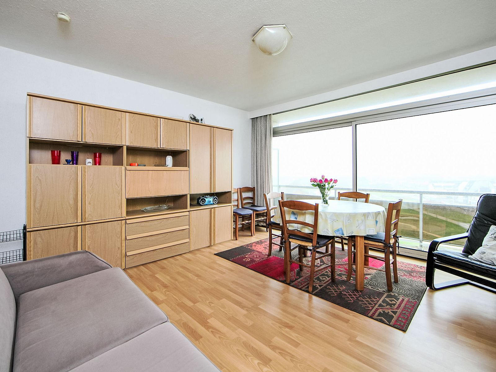 Cozy living room of Apartment Ref. 702 in Bredene on the Belgian coast with spacious view and comfortable seating area.