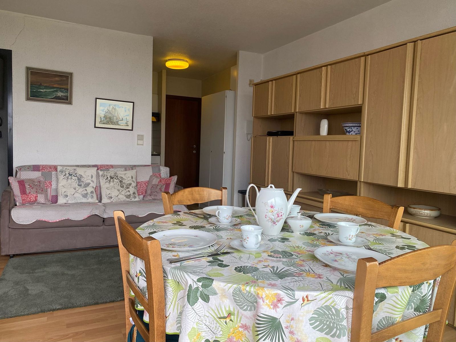 Cozy interior space of Apartment Ref. 702 in Bredene, Belgian coast, complete with dining area and comfortable sitting area.