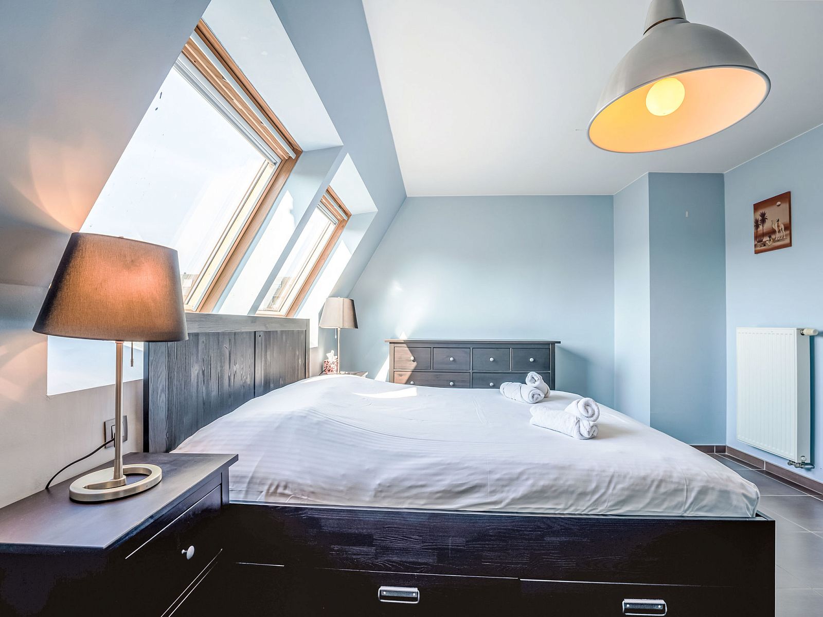 Bedroom in Apartment Ter Duyne, Bredene, Belgian coast. Spacious room with skylights and modern interior for a relaxing stay.