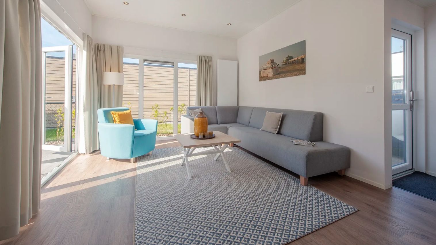 Cozy living room of Chalet in Bredene on the Belgian coast with modern decor and lots of natural light.