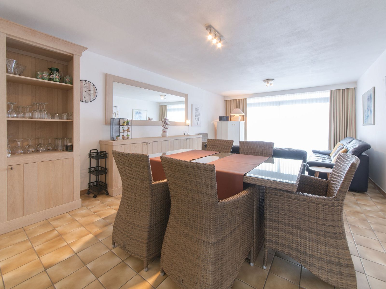 Spacious living room of Apartment 103 in Bredene on the Belgian coast, with comfortable seating and dining area for a relaxing stay.