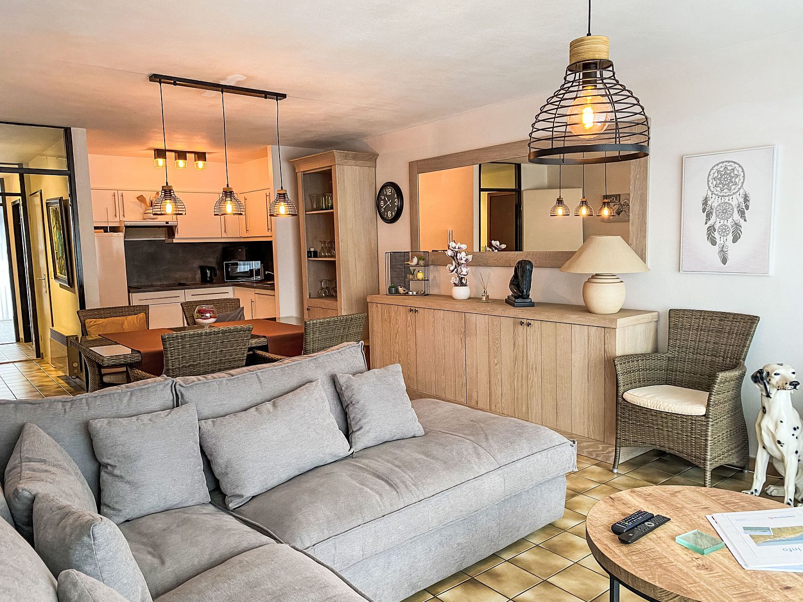 Cozy living room of Apartment 103 in Bredene, Belgian coast, with comfortable sitting area and modern kitchen.