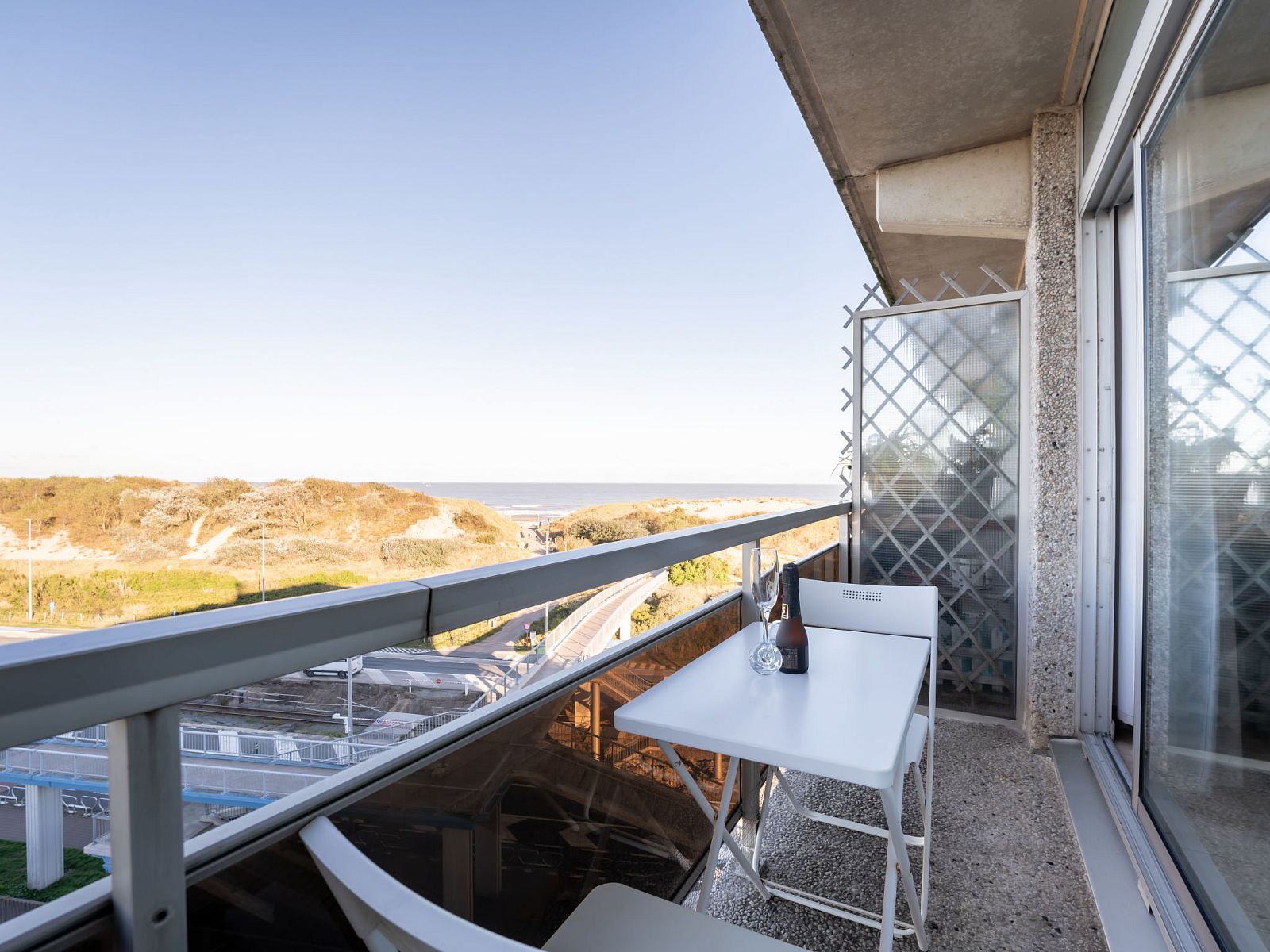 Enjoy the panoramic view from the balcony of Apartment Studio 62-705 in Bredene on the Belgian coast.