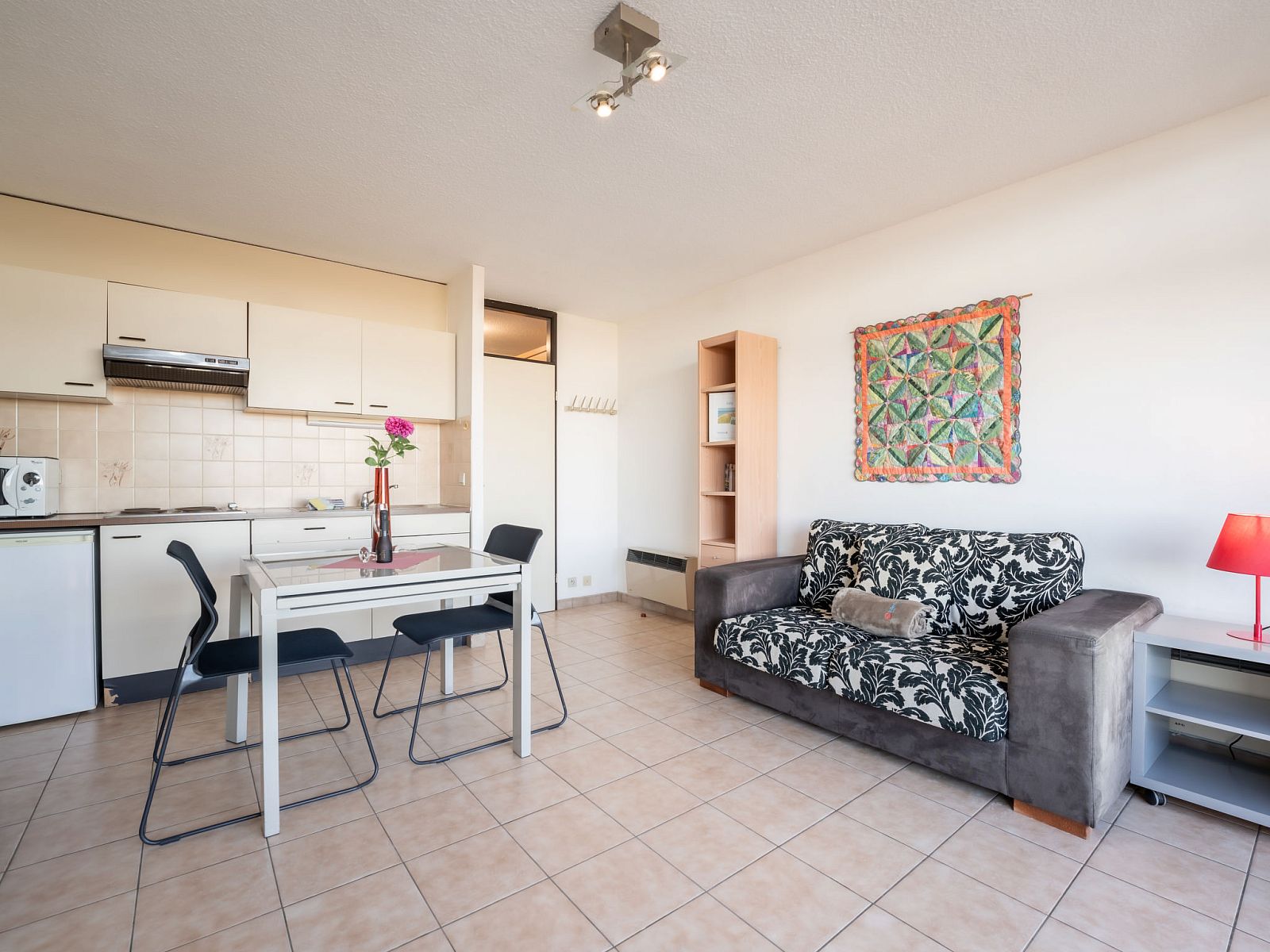 Cozy interior space of Apartment Studio 62-705 in Bredene, Belgian coast, with kitchen and comfortable sitting area.