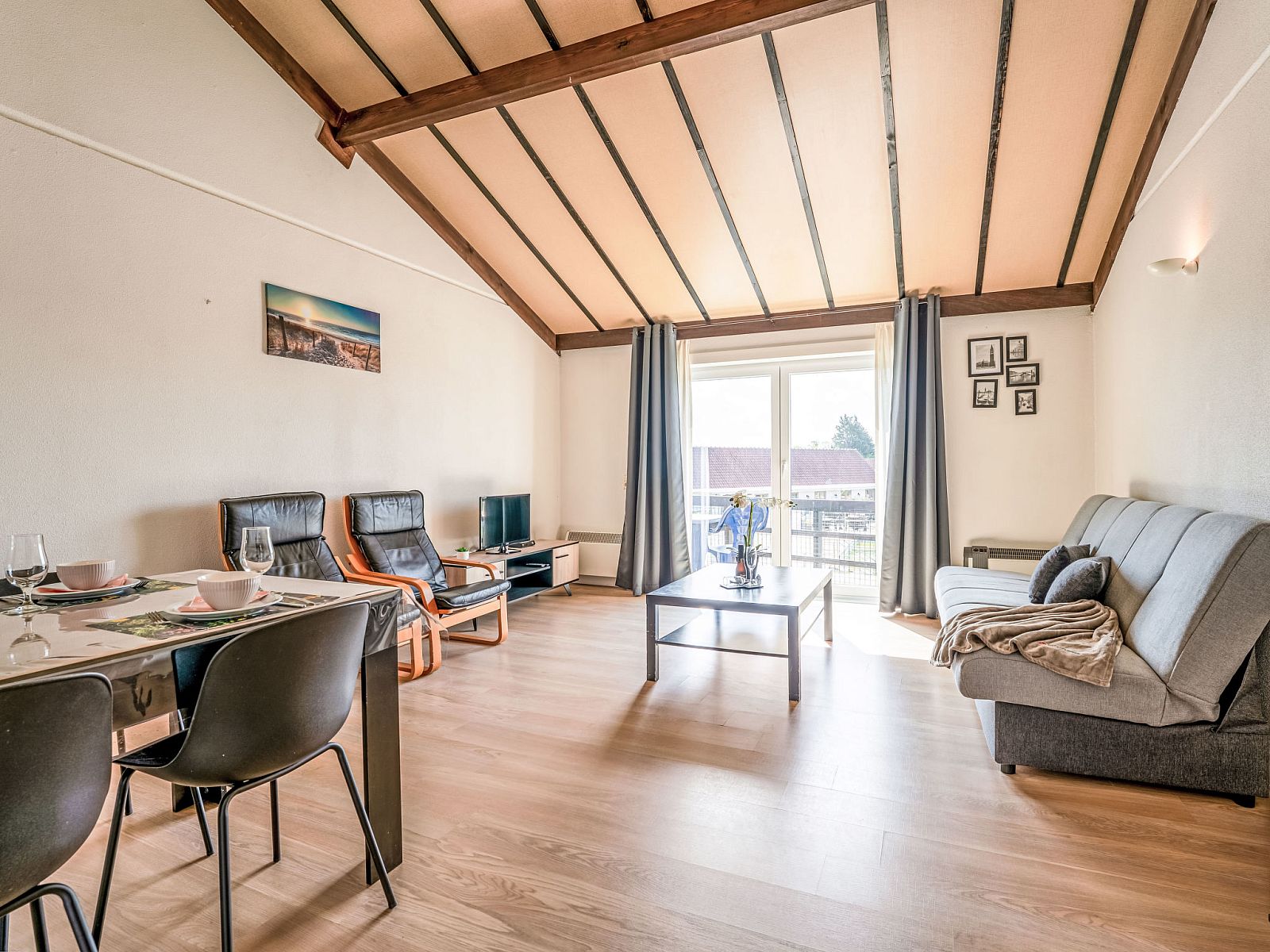 Bright living room of Apartment Zeewind II A 11 in Bredene, Belgian coast, with modern furnishings and terrace views.