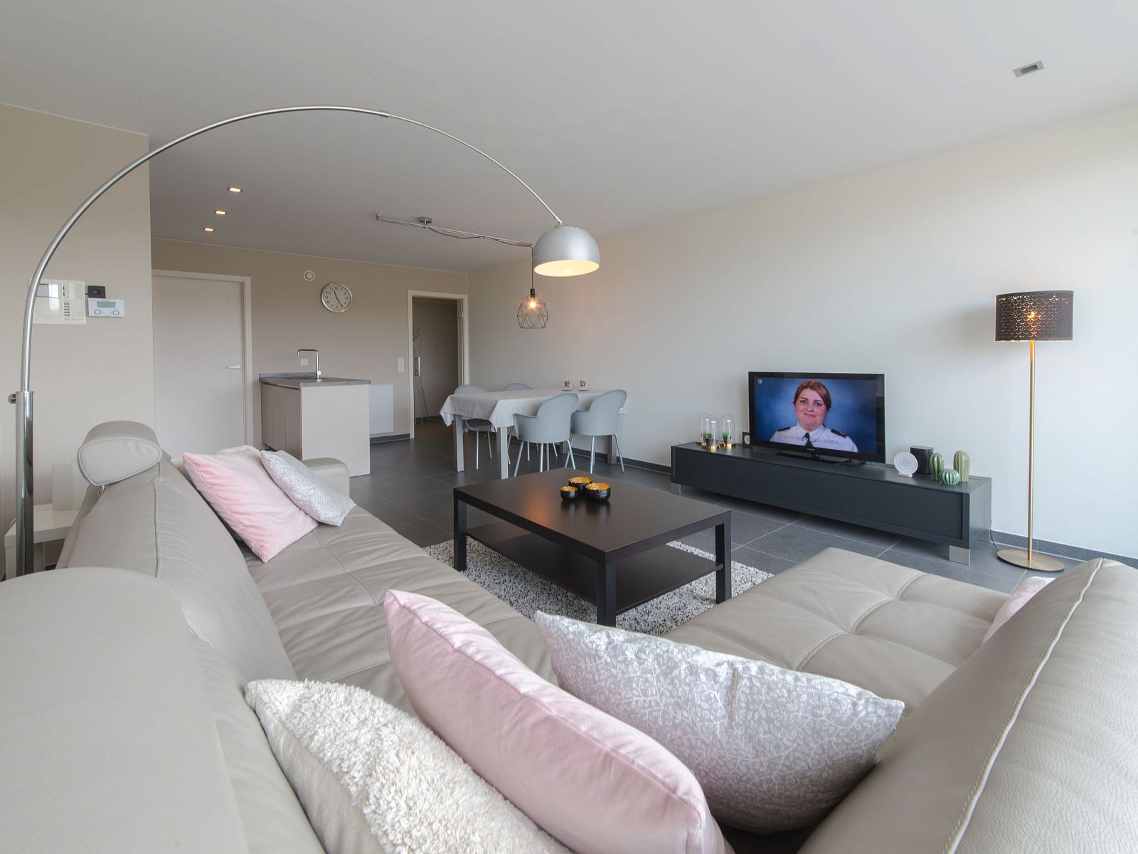 Modern living room in Apartment Solis, Bredene, Belgian coast, with stylish decor and comfortable seating area.
