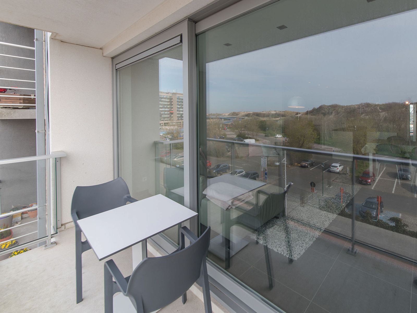 Enjoy the view from the terrace of Apartment Solis, a comfortable stay on the Belgian coast in Bredene.