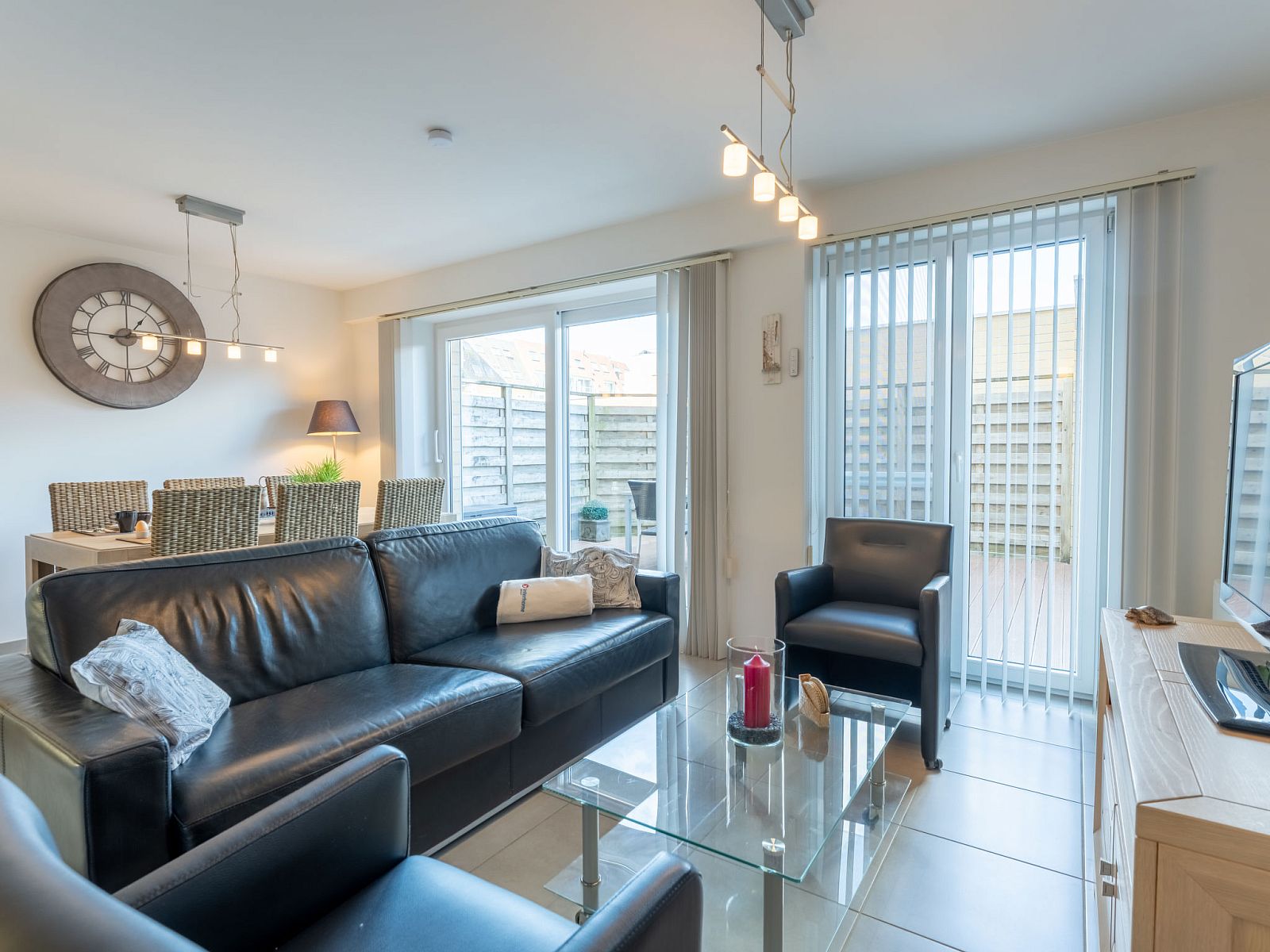 Cozy living room of Apartment Residentie Zandloper in Bredene, Belgian coast, with modern decor and lots of natural light.