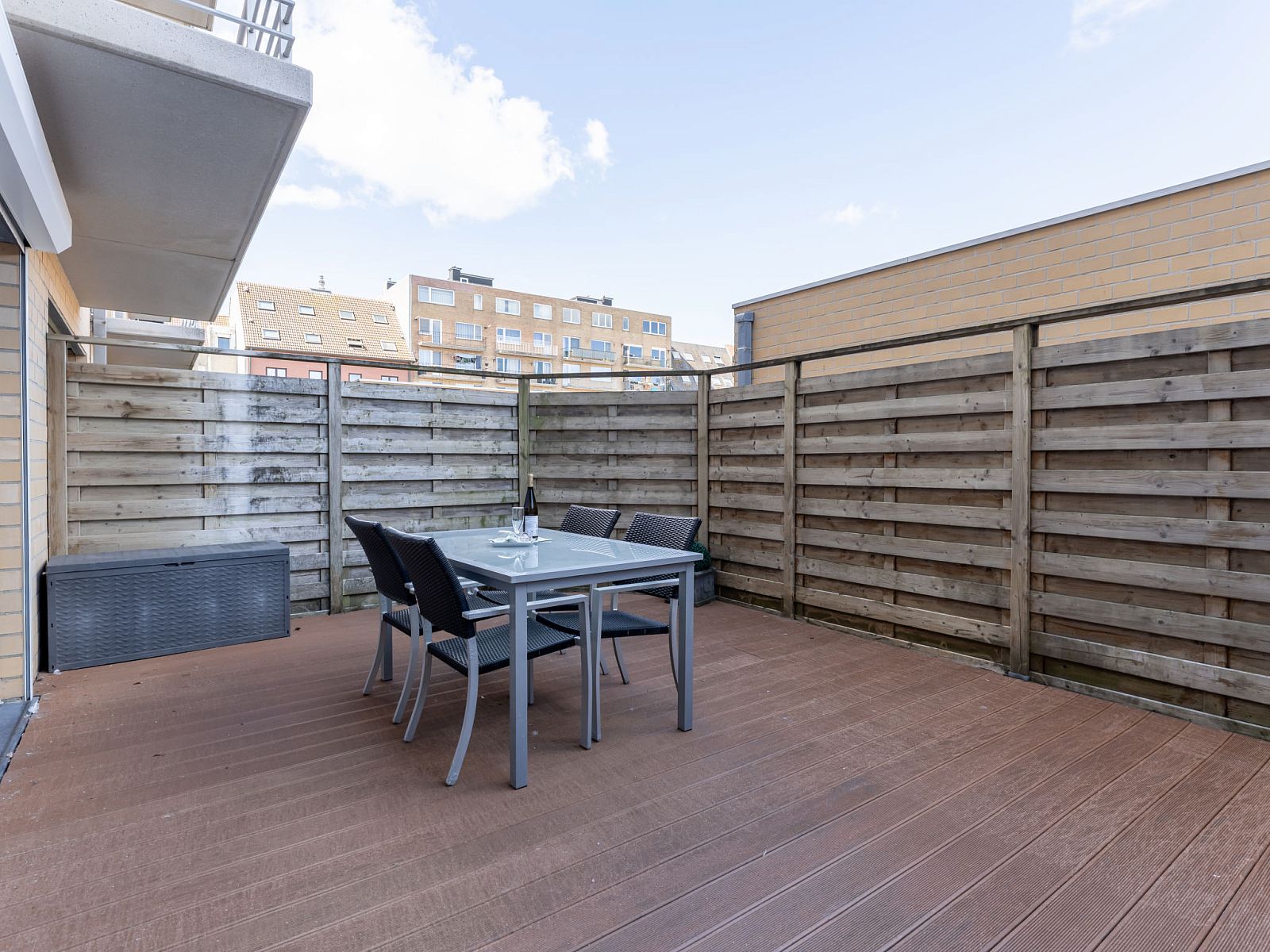 Enjoy the spacious terrace at Apartment Residentie Zandloper in Bredene, Belgian coast, ideal for relaxed outdoor dining.