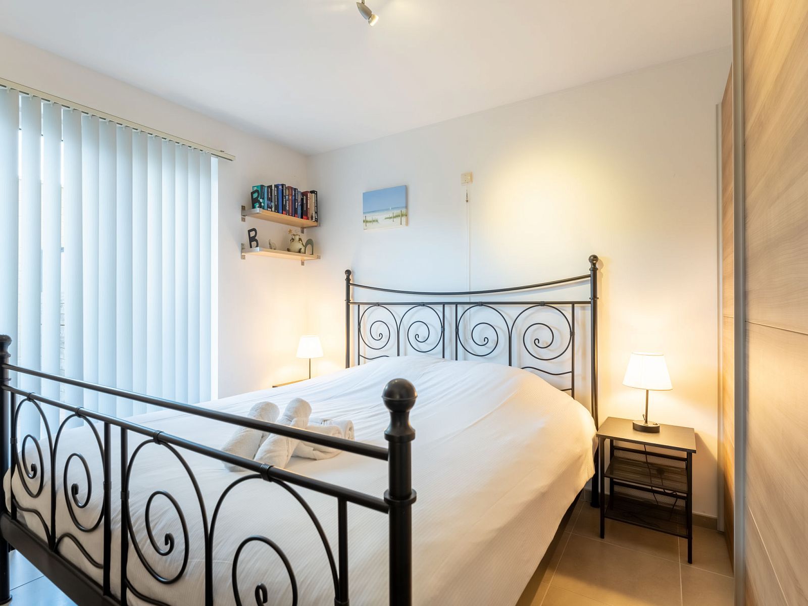 Cozy bedroom in Apartment Residentie Zandloper, Bredene, Belgian coast. Comfortable furnishings for a relaxing stay.