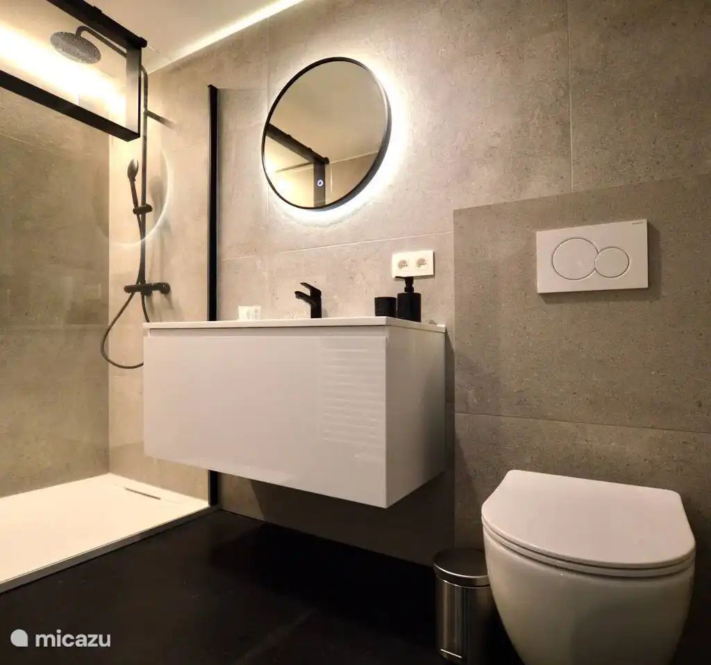 't Silte Apartment with a terrace in Middelkerke features a modern bathroom, ideal for a relaxing stay on the Belgian coast.