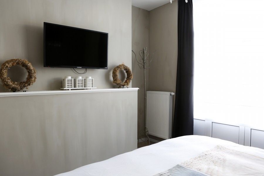 Moderne slaapkamer in appartement De Zeester in Oostende, Belgische kust met stijlvolle inrichting.