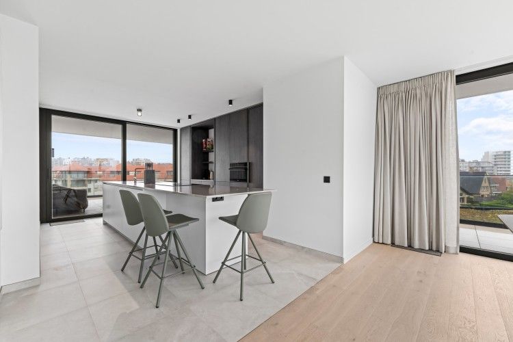 Modern kitchen in Penthouse 'Ter Elst', a luxury apartment in De Panne on the Belgian coast with a view of the city.