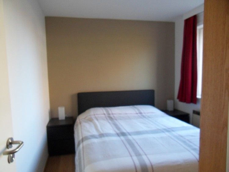 Comfortable bedroom in Zonneblik aan zee vacation apartment in De Panne, perfect for relaxation on the Belgian coast.