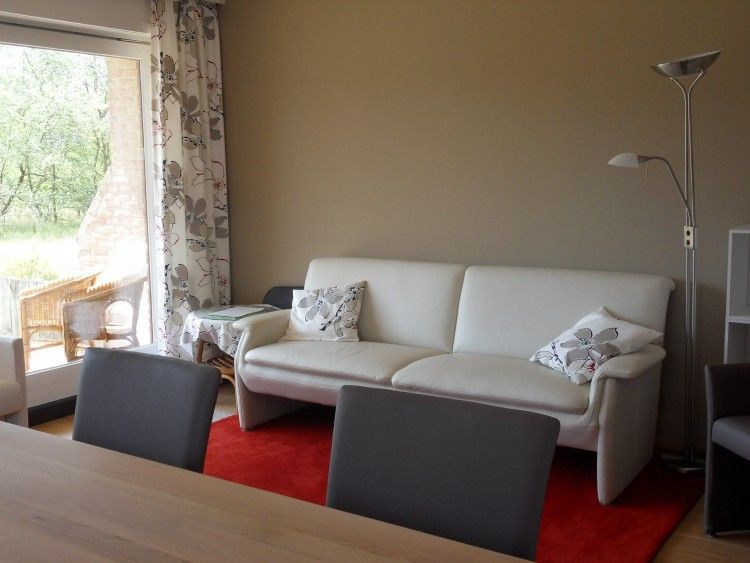 Cozy sitting area in Zonneblik aan zee apartment in De Panne overlooking the dunes on the Belgian coast.