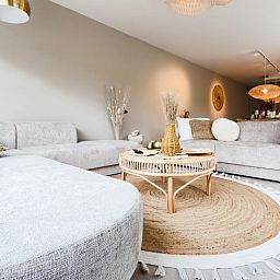 Komfortable Sitzecke im Ferienhaus Suiriri, De Haan, mit moderner Einrichtung und gemuetlicher Atmosphaere.
