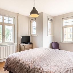 Attractive bedroom in vacation home Au Coin, Koksijde, with lots of natural light and views of the surroundings of West Flanders.