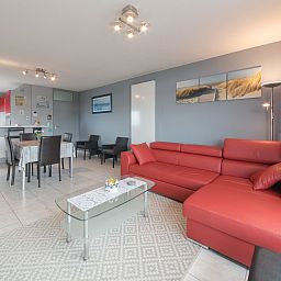 Stylish living room in Apartment Apt. 403 in Bredene, West Flanders, Belgium, featuring modern furnishings and comfortable seating.