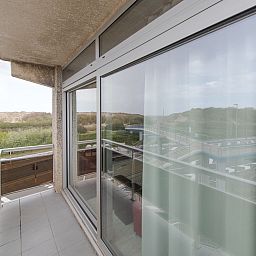 Enjoy the view from the balcony of Apartment Apt. 403 in Bredene, West Flanders, overlooking the dunes and nature.